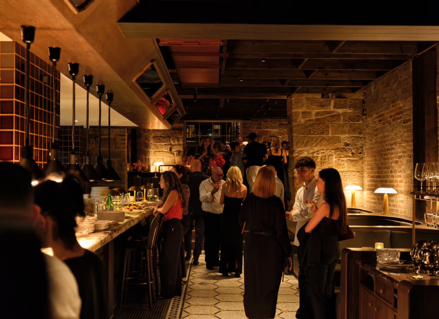 Guests dining in Grappa The Rocks sandstone dining room